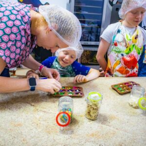 "Family enjoying a chocolate workshop in Cartagena making handmade chocolates"