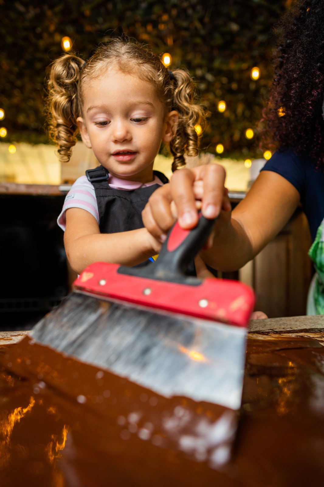 "Child making chocolate during a chocolate workshop in Cartagena Colombia"