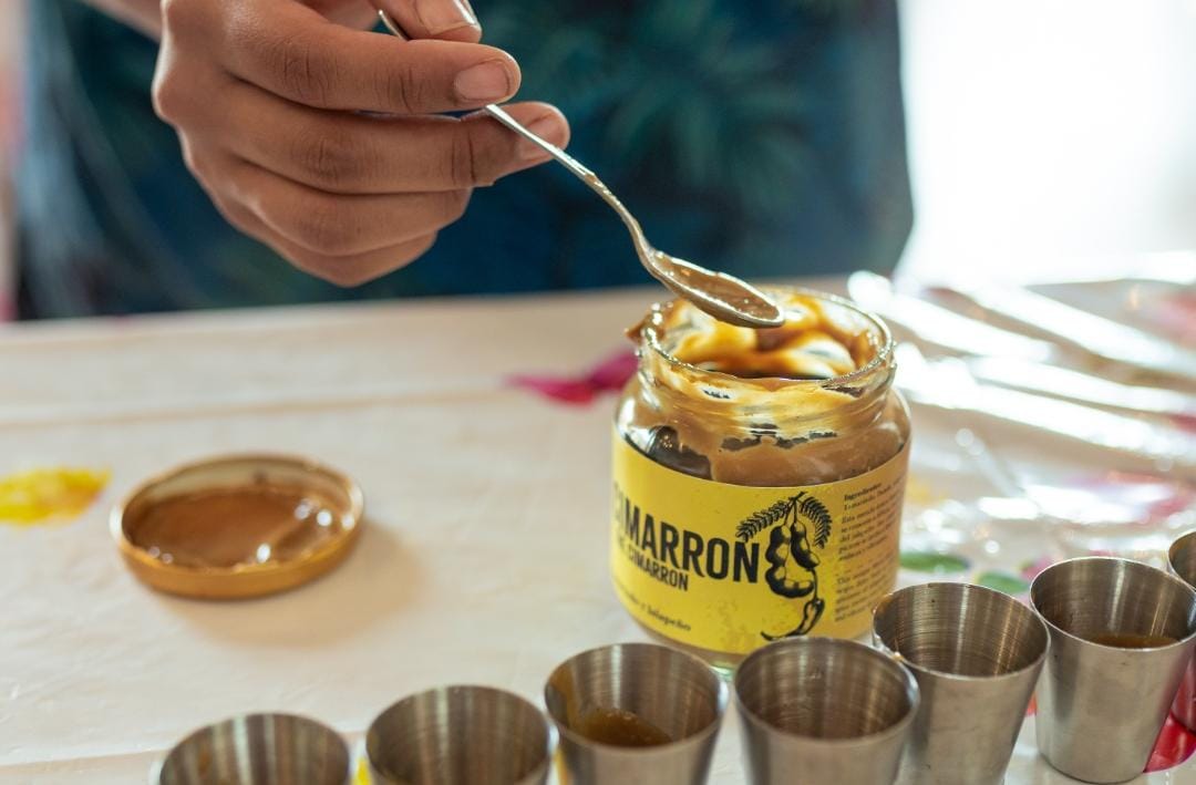 "Preparing traditional Colombian sauces during a cooking workshop in Cartagena"