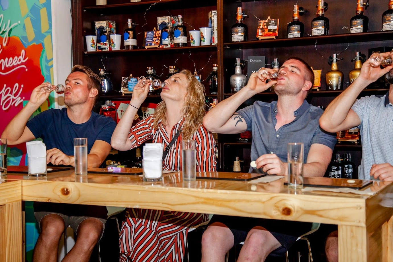 "Group enjoying a rum tasting experience with locals in Cartagena Colombia"