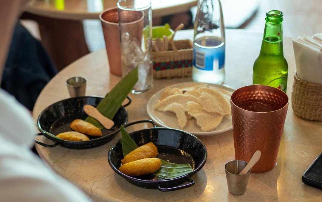"Colombian fried snacks served during a street food experience in Cartagena"
