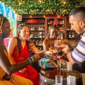 "Travelers enjoying rum shots during a guided rum tasting experience in Cartagena"